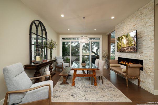 Dining room, Fireplace, Interior, Living room, Pendant Lights, Recessed Lighting, Stone Walls, Wood Texture Flooring