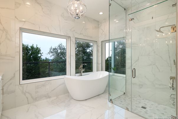 Bathroom, Free Standing Baths, Glass Shower, Interior, Marble, Marble Walls, Pendant Lights, Recessed Lighting