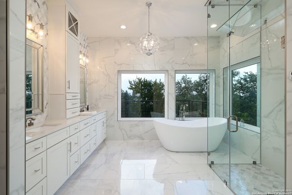 Bathroom, Dual Sink Vanities, Free Standing Baths, Glass Shower, Interior, Marble, Marble Walls, Pendant Lights, Recessed Lighting
