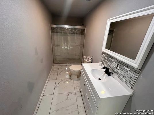 Bathroom, Dual Sink Vanities, Glass Shower, Interior, Marble, Recessed Lighting