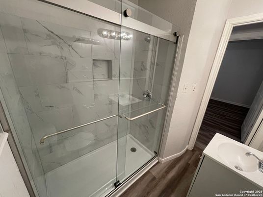 Bathroom, Glass Shower, Interior, Marble Walls, Wood Texture Flooring