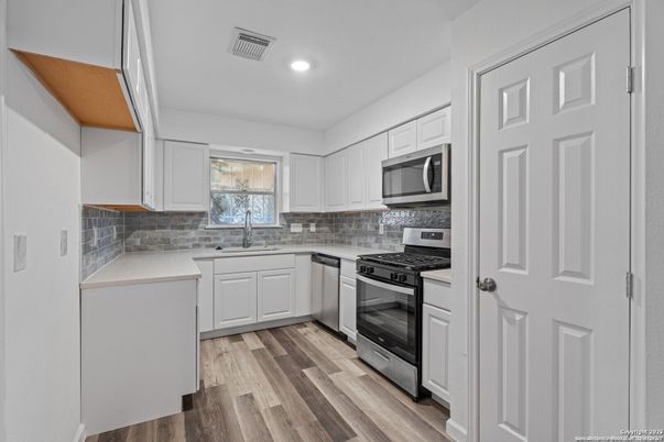 Interior, Kitchen, Recessed Lighting, Stainless Steel Appliances, Wood Texture Flooring