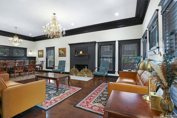 Chandelier, Dining room, Fireplace, Interior, Living room, Piano, Recessed Lighting, Wood Texture Flooring