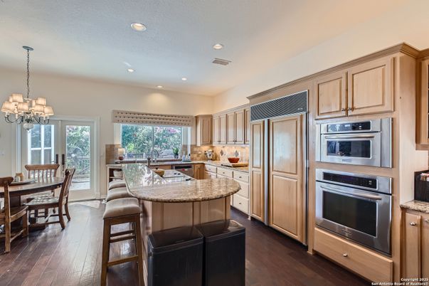Chandelier, Dining room, Interior, Kitchen, Pendant Lights, Recessed Lighting, Stainless Steel Appliances, Wood Texture Flooring