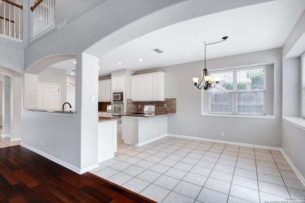 Chandelier, Interior, Kitchen, Recessed Lighting, Stainless Steel Appliances, Wood Texture Flooring