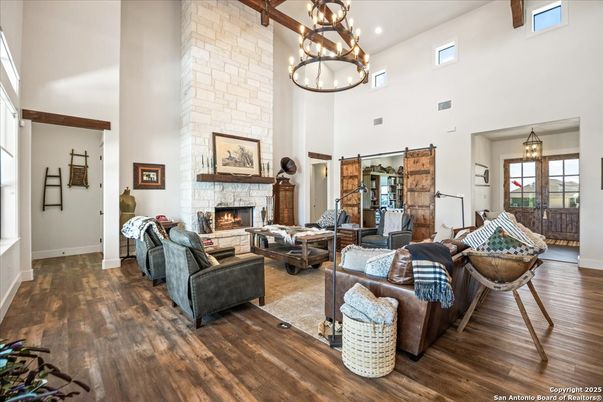 Fireplace, Interior, Living room, Pendant Lights, Recessed Lighting, Stone Walls, Wood Texture Flooring