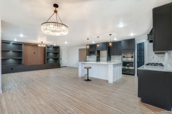 Chandelier, Interior, Kitchen, Pendant Lights, Recessed Lighting, Stainless Steel Appliances, Wood Texture Flooring