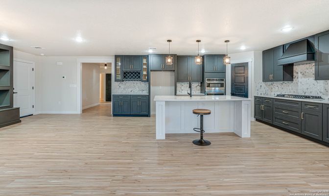 Interior, Kitchen, Marble Walls, Pendant Lights, Recessed Lighting, Stainless Steel Appliances, Wood Texture Flooring