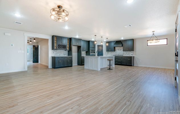 Interior, Kitchen, Marble Walls, Pendant Lights, Recessed Lighting, Wood Texture Flooring