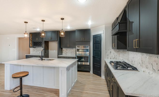 Interior, Kitchen, Marble Walls, Pendant Lights, Recessed Lighting, Stainless Steel Appliances, Wood Texture Flooring