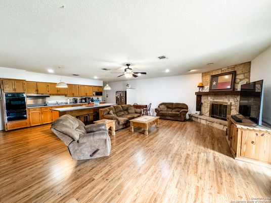 Fireplace, Interior, Kitchen, Living room, Pendant Lights, Recessed Lighting, Stone Walls, Wood Texture Flooring