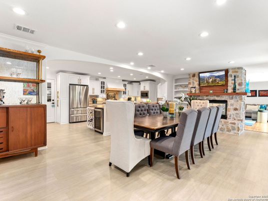 Dining room, Fireplace, Interior, Kitchen, Recessed Lighting, Stainless Steel Appliances, Stone Walls, Wood Texture Flooring