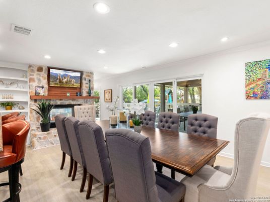 Dining room, Fireplace, Interior, Living room, Recessed Lighting, Stone Walls, Wood Texture Flooring