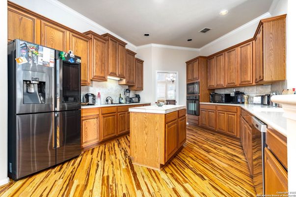 Interior, Kitchen, Recessed Lighting, Tile Countertops, Wood Texture Flooring