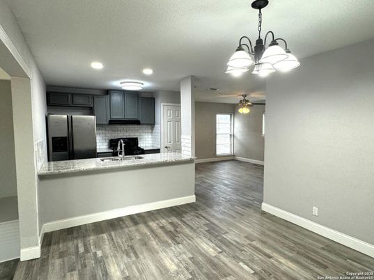 Chandelier, Interior, Kitchen, Recessed Lighting, Stainless Steel Appliances, Wood Texture Flooring