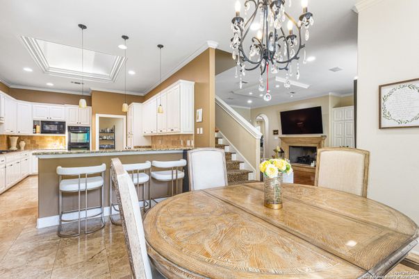 Chandelier, Dining room, Fireplace, Interior, Kitchen, Pendant Lights, Recessed Lighting, Stainless Steel Appliances