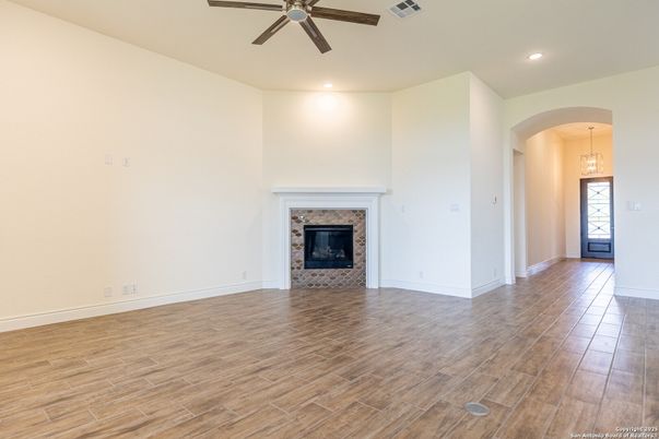 Empty room, Fireplace, Interior, Pendant Lights, Recessed Lighting, Wood Texture Flooring