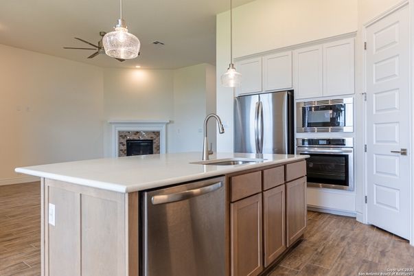 Fireplace, Interior, Kitchen, Pendant Lights, Recessed Lighting, Stainless Steel Appliances, Wood Texture Flooring