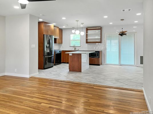 Interior, Kitchen, Marble, Pendant Lights, Recessed Lighting, Stainless Steel Appliances, Wood Texture Flooring
