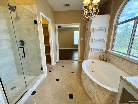 Bathroom, Chandelier, Glass Shower, Interior, Marble Walls, Wood Texture Flooring