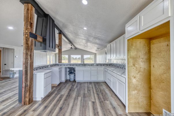 Interior, Kitchen, Recessed Lighting, Washer, Wood Texture Flooring