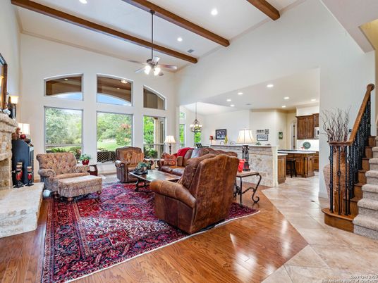 Chandelier, Fireplace, Interior, Living room, Pendant Lights, Recessed Lighting, Wooden Beams, Wood Texture Flooring