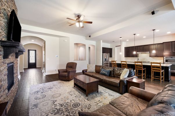 Fireplace, Interior, Kitchen, Living room, Pendant Lights, Recessed Lighting, Stainless Steel Appliances, Wood Texture Flooring