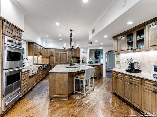 Chandelier, Interior, Kitchen, Pendant Lights, Recessed Lighting, Stainless Steel Appliances, Wood Texture Flooring