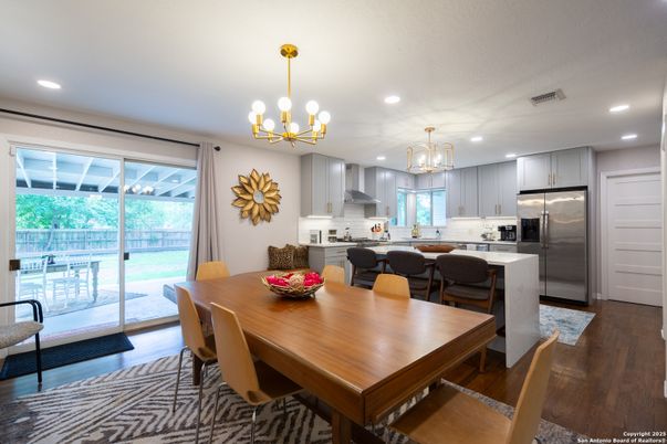 Chandelier, Dining room, Interior, Kitchen, Pendant Lights, Recessed Lighting, Stainless Steel Appliances, Wood Texture Flooring