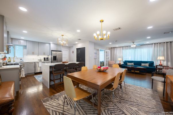 Chandelier, Dining room, Interior, Kitchen, Living room, Pendant Lights, Recessed Lighting, Stainless Steel Appliances, Wood Texture Flooring