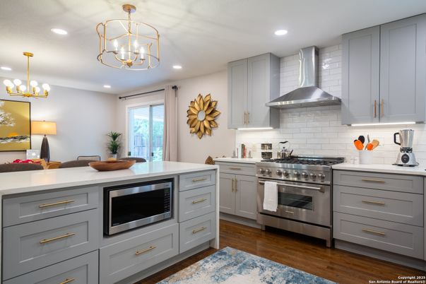 Chandelier, Interior, Kitchen, Pendant Lights, Recessed Lighting, Stainless Steel Appliances, Wood Texture Flooring