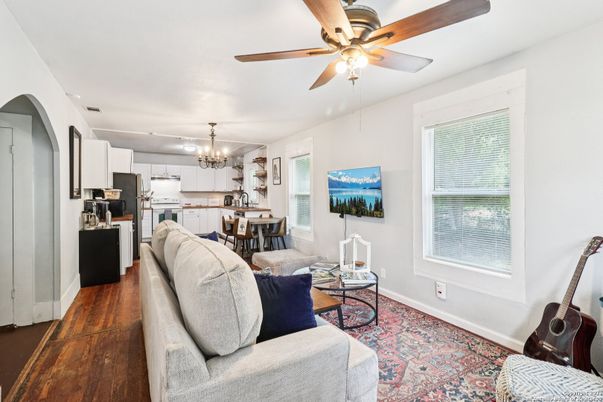 Chandelier, Dining room, Interior, Kitchen, Living room, Stainless Steel Appliances, Wood Texture Flooring