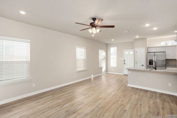 Empty room, Interior, Kitchen, Recessed Lighting, Stainless Steel Appliances, Wood Texture Flooring