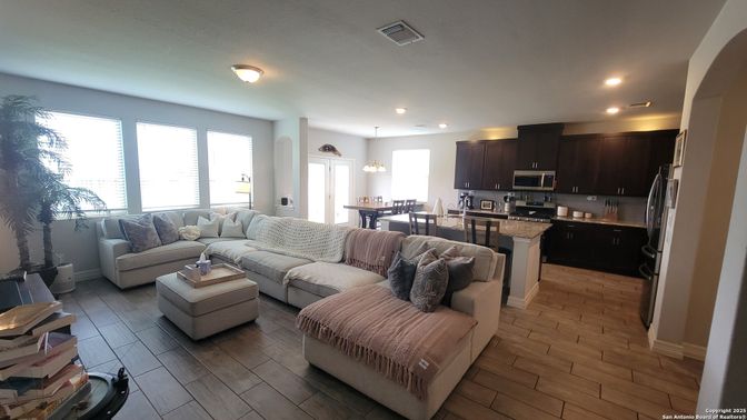 Dining room, Interior, Kitchen, Living room, Pendant Lights, Recessed Lighting, Stainless Steel Appliances, Wood Texture Flooring