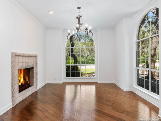 Chandelier, Empty room, Fireplace, Interior, Recessed Lighting, Wood Texture Flooring