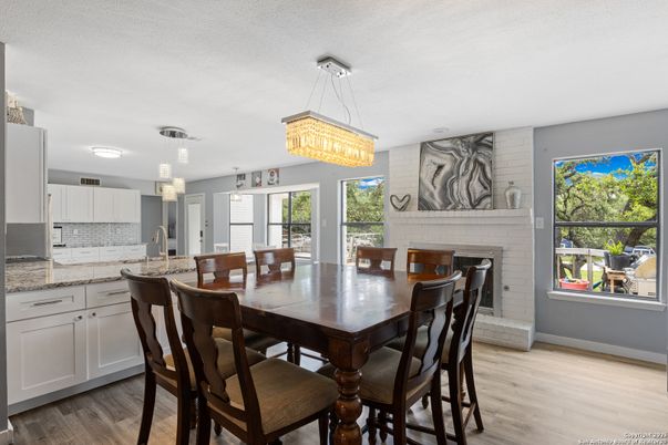 Chandelier, Dining room, Fireplace, Interior, Kitchen, Pendant Lights, Wood Texture Flooring