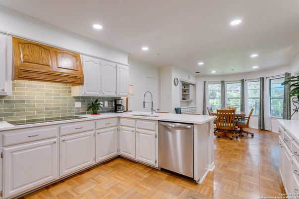 Dining room, Interior, Kitchen, Recessed Lighting, Stainless Steel Appliances, Wood Texture Flooring