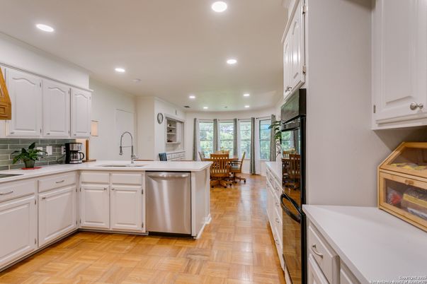 Dining room, Interior, Kitchen, Recessed Lighting, Stainless Steel Appliances, Wood Texture Flooring