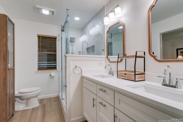 Bathroom, Dual Sink Vanities, Glass Shower, Interior, Recessed Lighting, Wood Texture Flooring