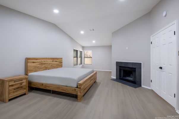 Bedroom, Fireplace, Interior, Recessed Lighting, Wood Texture Flooring