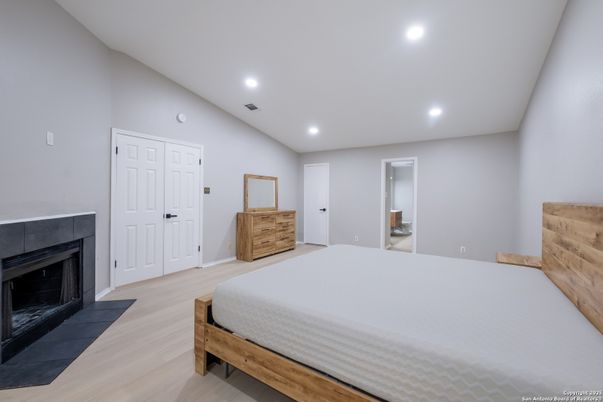 Bedroom, Fireplace, Interior, Recessed Lighting, Wood Texture Flooring