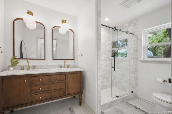 Bathroom, Dual Sink Vanities, Glass Shower, Interior, Marble Walls, Recessed Lighting