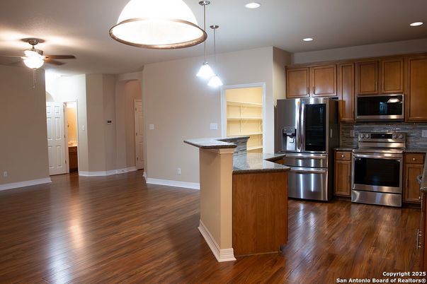 Interior, Kitchen, Pendant Lights, Recessed Lighting, Stainless Steel Appliances, Wood Texture Flooring