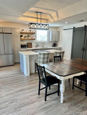 Dining room, Interior, Kitchen, Pendant Lights, Stainless Steel Appliances, Wood Texture Flooring
