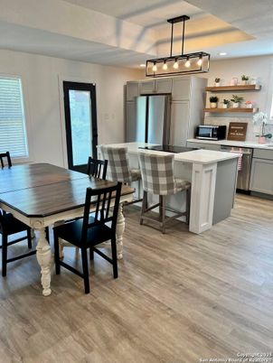 Dining room, Interior, Kitchen, Pendant Lights, Recessed Lighting, Stainless Steel Appliances, Wood Texture Flooring