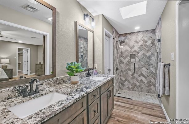 Bathroom, Dual Sink Vanities, Glass Shower, Interior, Recessed Lighting, Wood Texture Flooring
