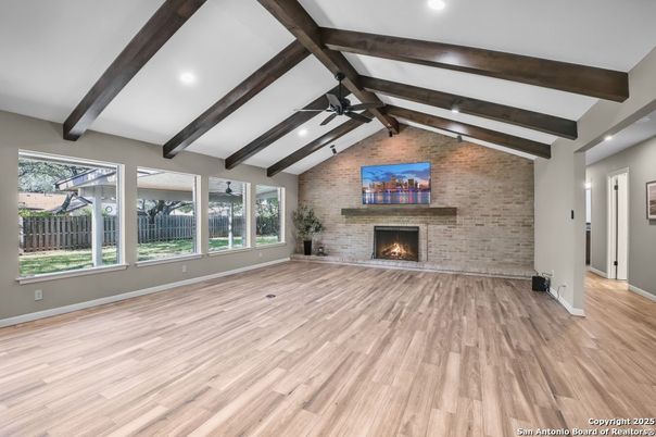 Empty room, Fireplace, Interior, Recessed Lighting, Stone Walls, Wooden Beams, Wood Texture Flooring