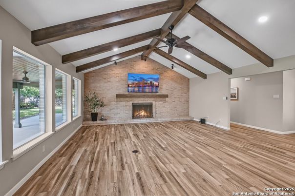 Empty room, Fireplace, Interior, Recessed Lighting, Stone Walls, Wooden Beams, Wood Texture Flooring