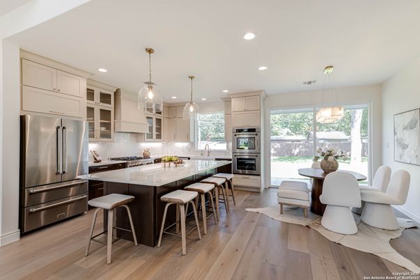 Dining room, Interior, Kitchen, Pendant Lights, Recessed Lighting, Stainless Steel Appliances, Wood Texture Flooring