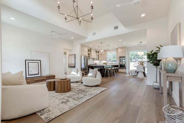 Chandelier, Dining room, Interior, Kitchen, Living room, Pendant Lights, Recessed Lighting, Stainless Steel Appliances, Wood Texture Flooring